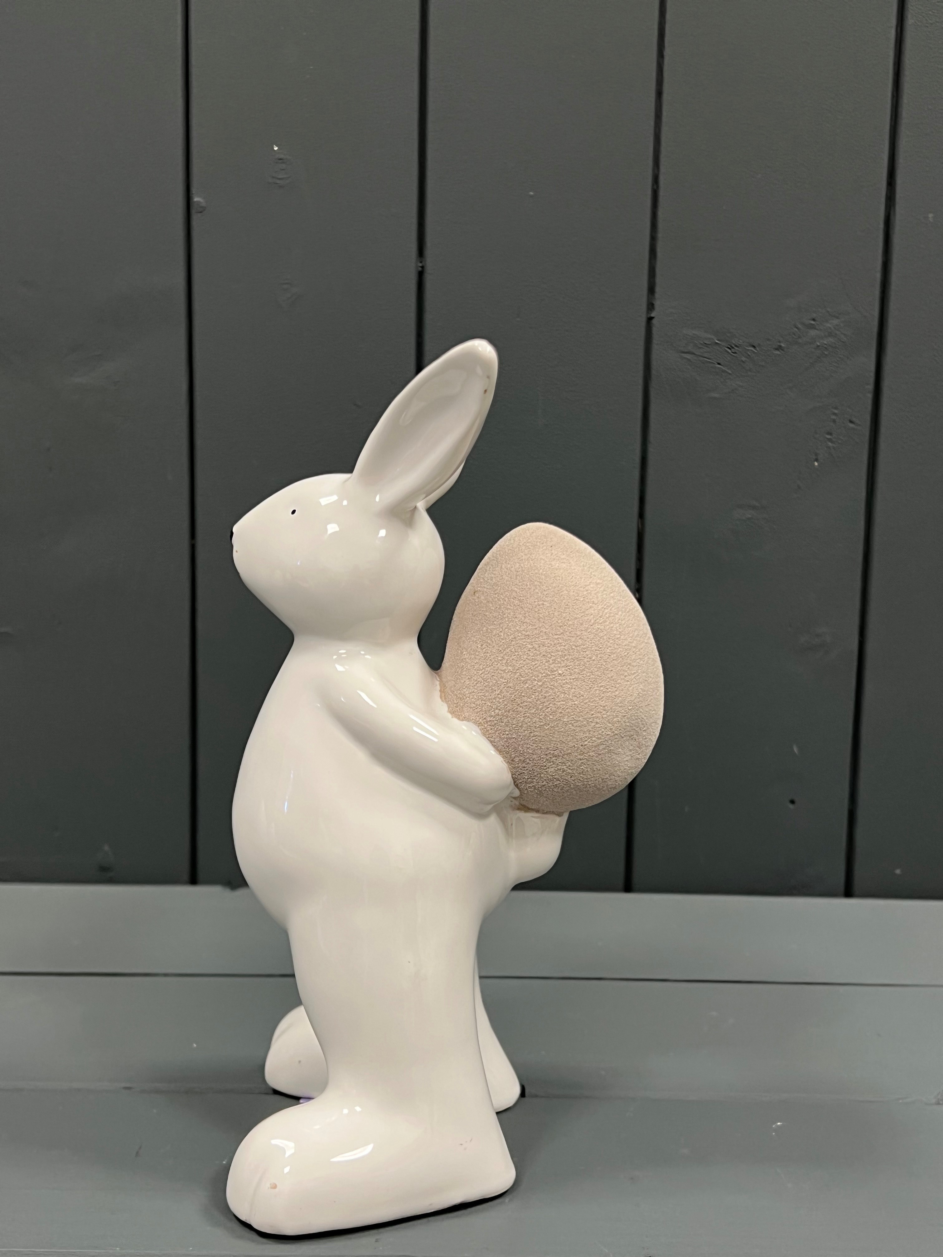 Large White Ceramic Rabbit with Easter Egg detail page